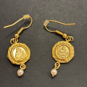 Vintage earrings gold tone Virgin Mary medallions.